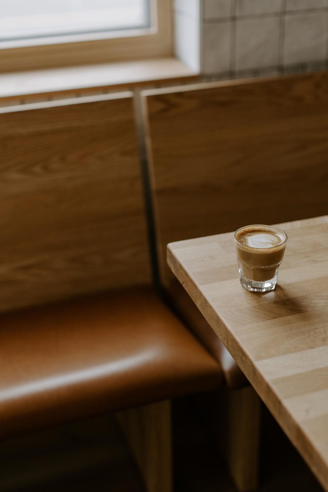 A latte in the corner booth