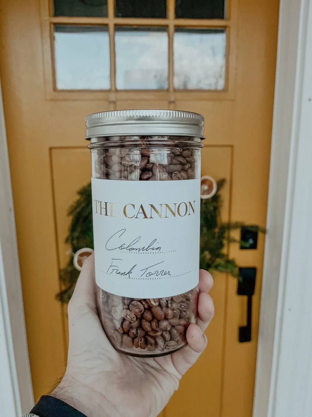 A jar of The Cannon's own roasted coffee beans