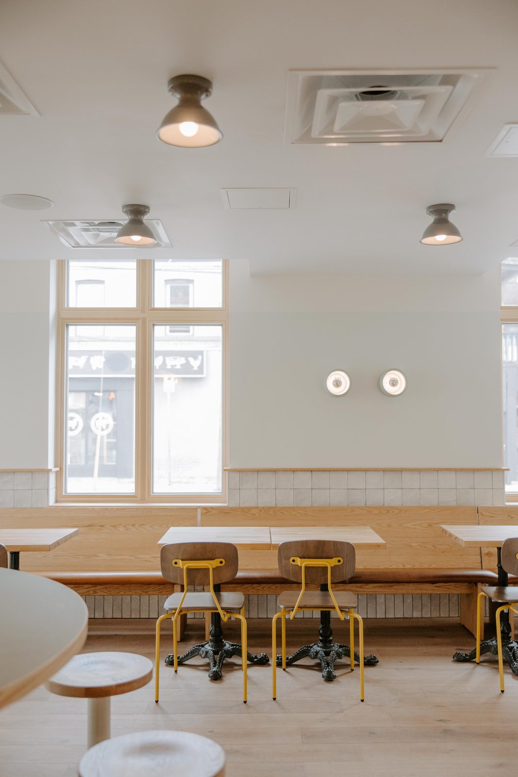 Window seat with yellow stools